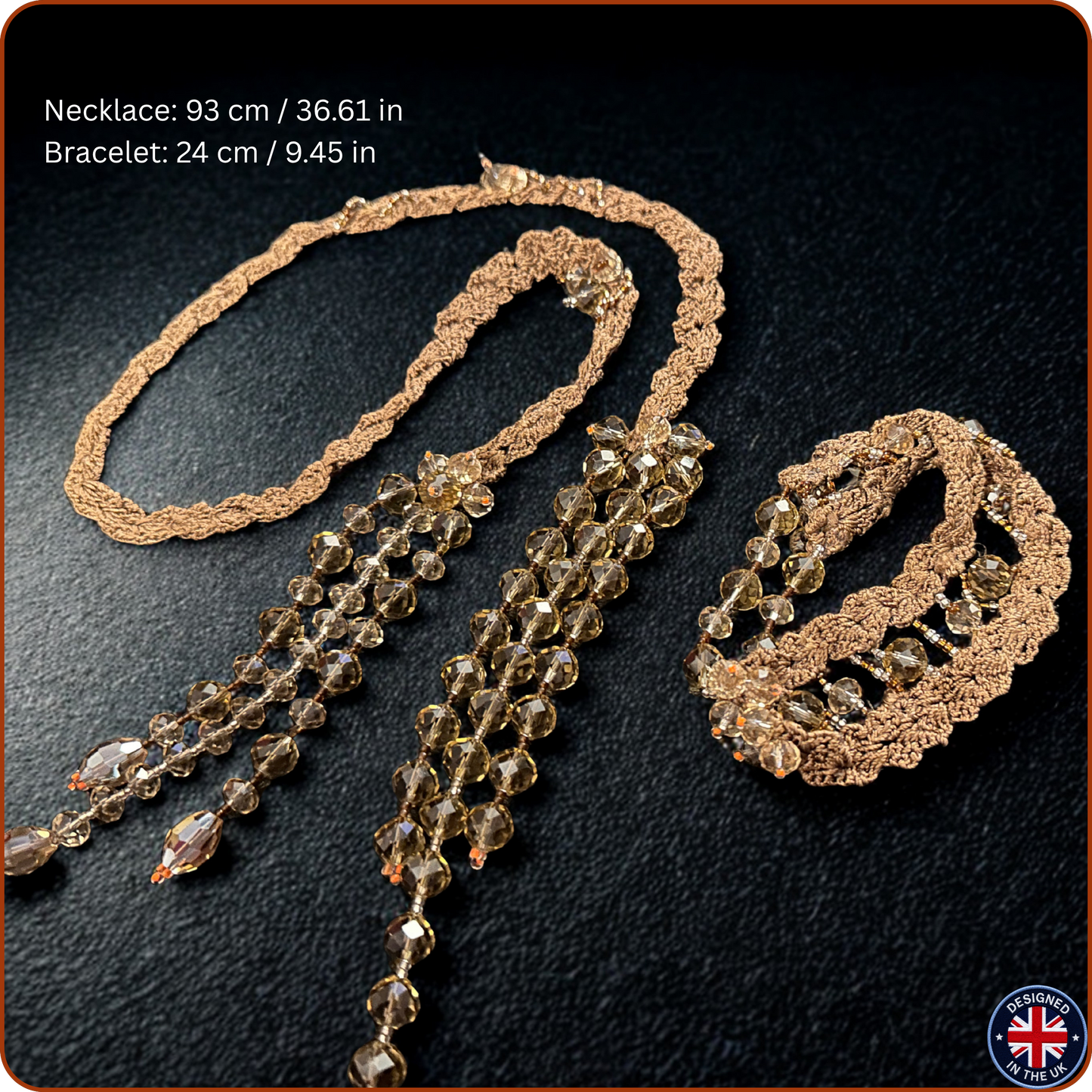 A jewelry set on a dark textured background, featuring a long beaded necklace and a matching bracelet. The necklaces and bracelets have a textured bronze or gold-toned metal base with cascading strands of faceted brown and smoky amber beads.