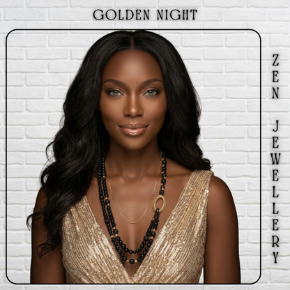 A woman with long wavy black hair is shown from the chest up against a white brick wall, wearing layered black beaded necklaces and a gold-toned ring accent. The image includes the text 'GOLDEN NIGHT' at the top and 'ZEN JEWELLERY' running vertically along the right side.