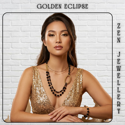 A woman wearing layered black beaded necklaces and a black beaded bracelet, styled with a gold sequined top, posed against a white brick wall background with 'GOLDEN ECLIPSE' and 'ZEN JEWELLERY' text overlays.