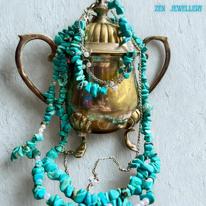 Handmade artisan jewellery with vibrant turquoise chips on stainless steel chain, perfect for layering.