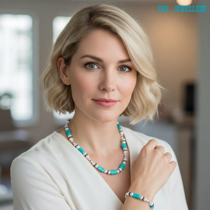 A detailed view of the turquoise pearl necklace and bracelet set showing turquoise pebble beads combined with white pearl beads and blue rhinestone spacers creating a bohemian turquoise jewelry look with sterling silver chain extensions visible and positioned carefully to display the full handcrafted structure and elegant styling.
