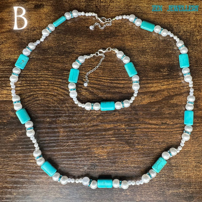 The handcrafted turquoise pearl jewellery set is shown in natural lighting on a wooden surface with turquoise beads, pearl beads, blue rhinestones, and sterling silver clasps forming an elegant bohemian turquoise necklace and bracelet set designed for comfort, durability, and stylish layering.