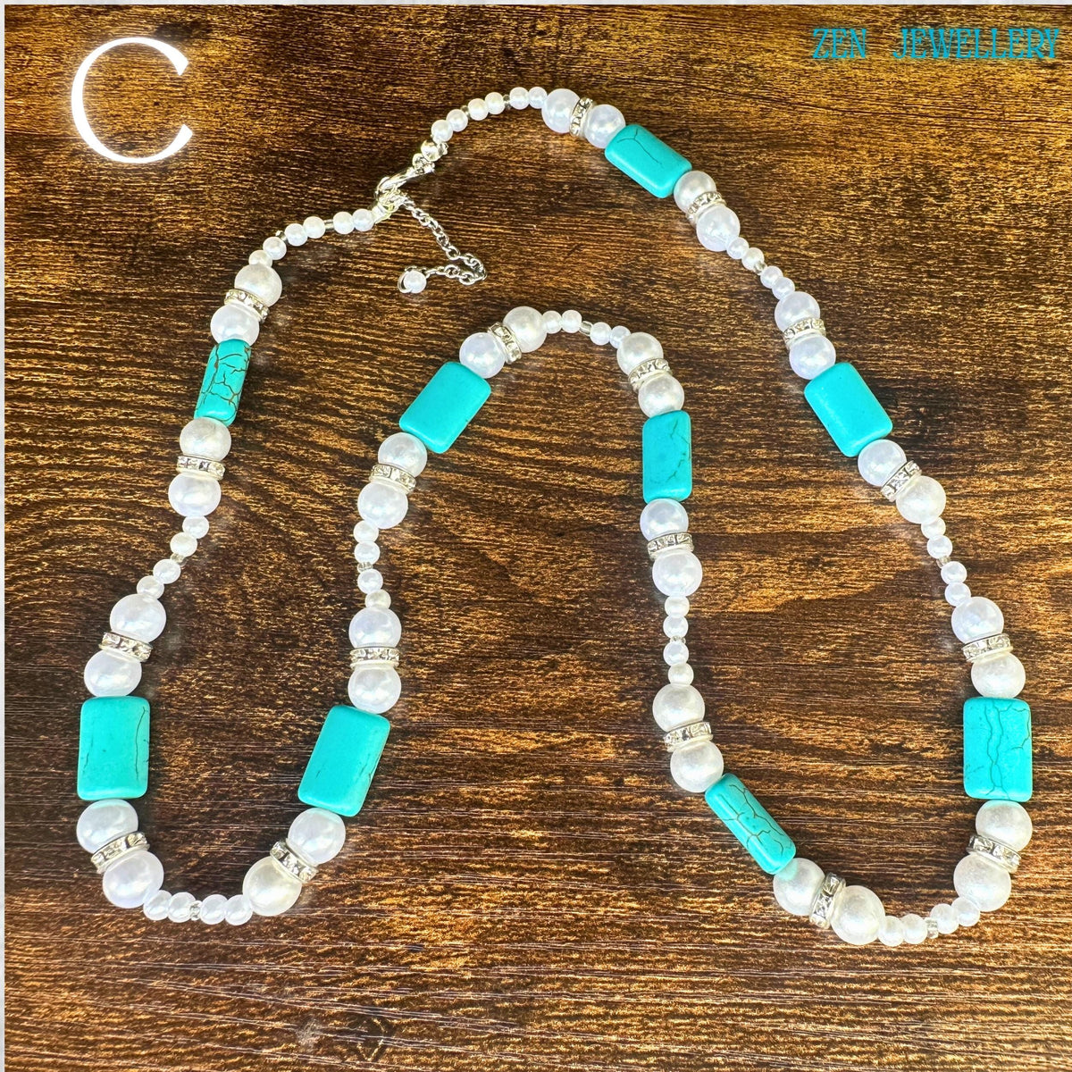 This handmade turquoise beaded necklace is displayed in natural lighting, showcasing the vivid turquoise colour variations and pearl bead glow. The necklace includes sterling silver clasps and detailed silver spacers, creating an upscale finish. The large turquoise pendant with tassel ending becomes the focal point while the overall design reflects timeless bohemian elegance and artistic jewellery craftsmanship.
