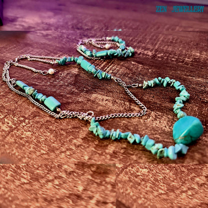 Angled shot showing layering effect of necklace strands, providing visual inspiration for styling with casual or dressy outfits.
Bracelet worn perspective showing how the double strand wraps elegantly around the wrist with balanced spacing of turquoise elements.