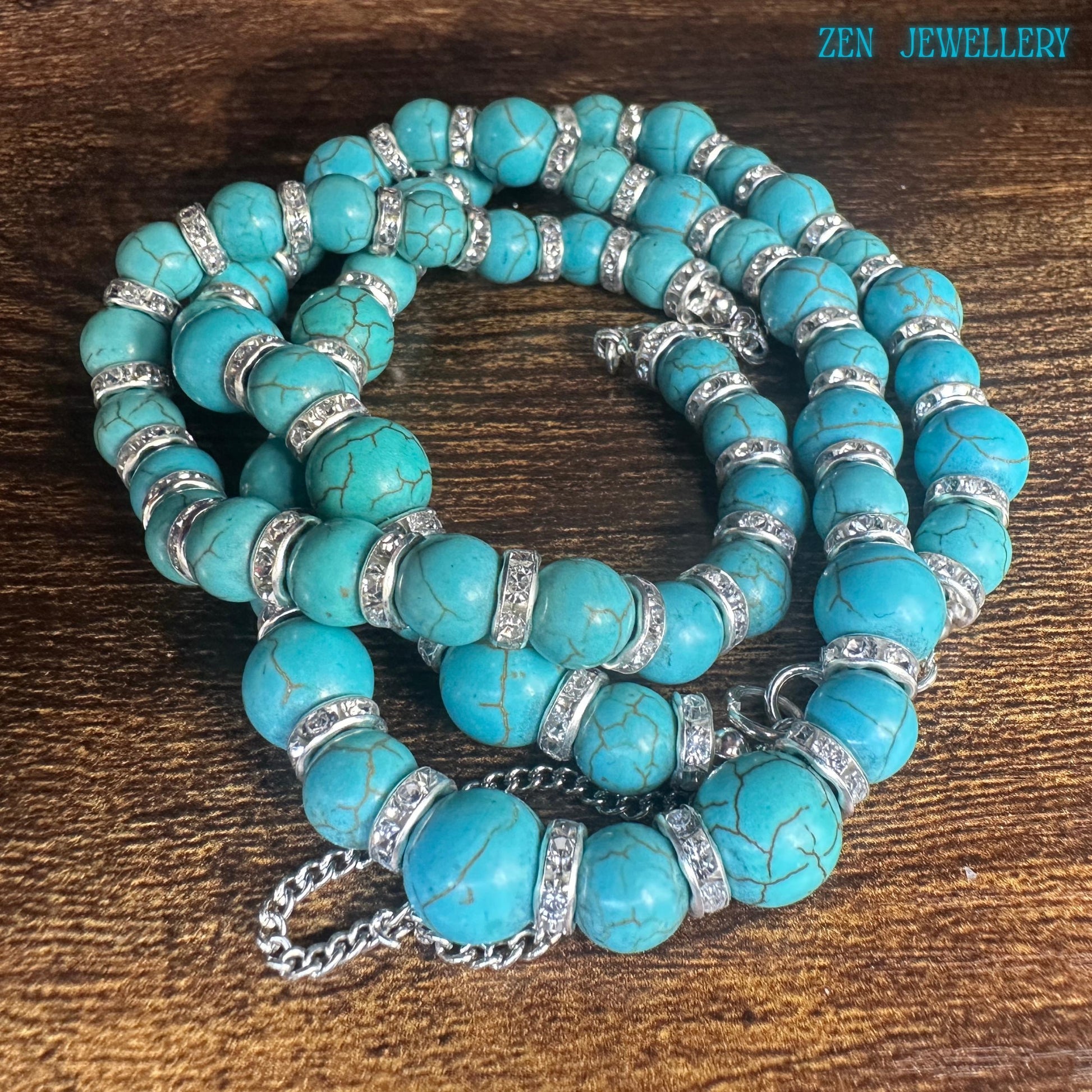A bohemian turquoise necklace and bracelet set displayed in a circular arrangement, showing the detailed handcrafted beadwork and sparkling silver rhinestone separators. The natural stone texture and polished finish create a museum-quality artisan appearance enhanced by sterling silver chain details and secure clasps.