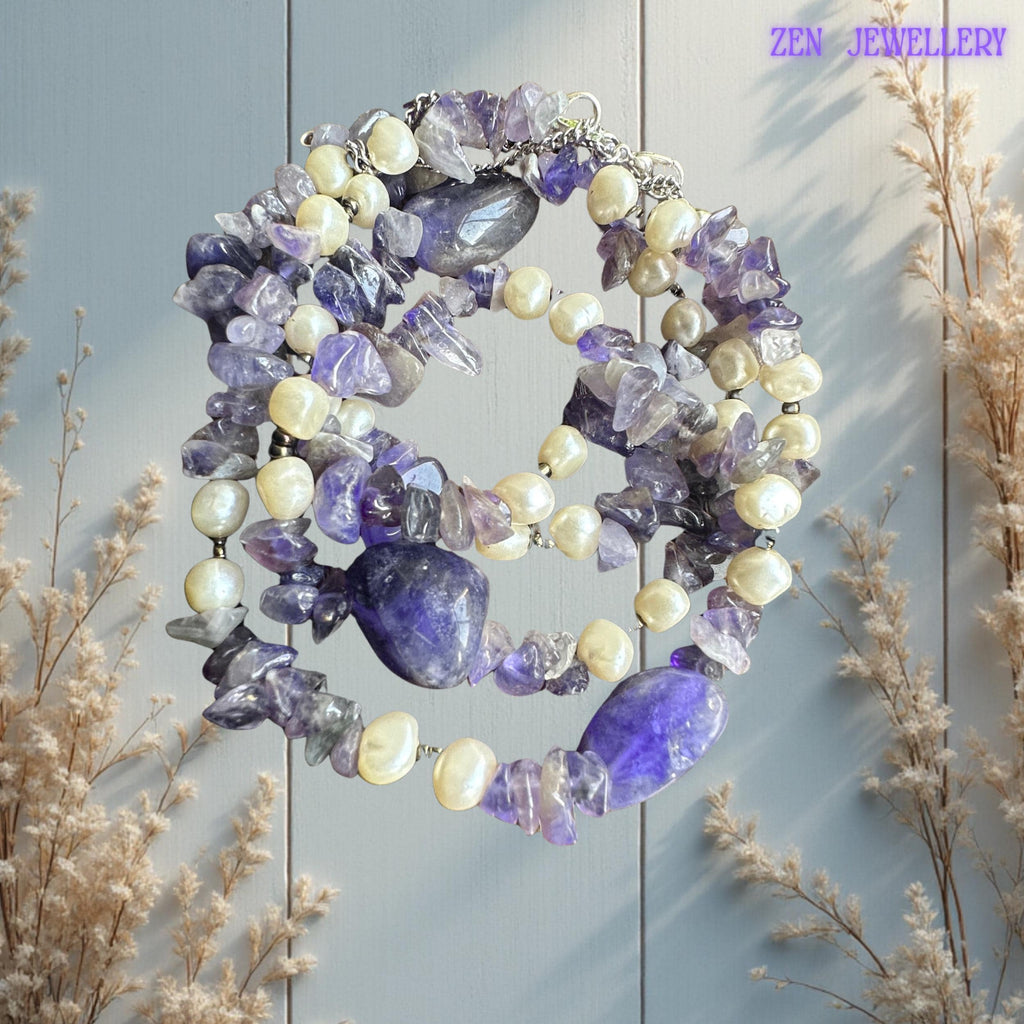 • This lightweight purple gemstone necklace and bracelet set pairs beautifully with dresses, festival outfits, romantic styling, or casual bohemian fashion. The soft lavender crystal tones symbolise calmness and creativity while the pearls add timeless elegance and softness.