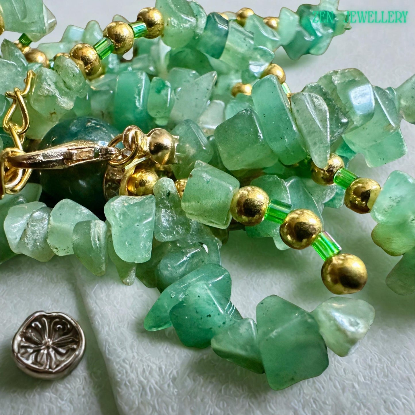 Handmade boho necklace with aventurine chips and gold beading.