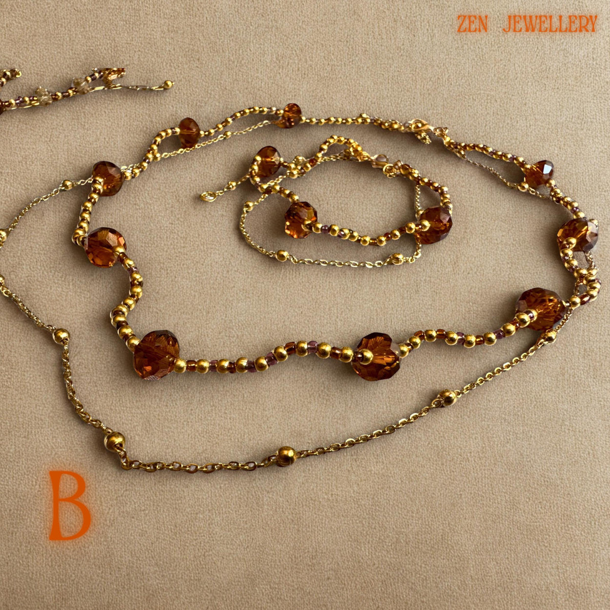 Elegant bohemian crystal necklace and bracelet set handcrafted with warm brown, champagne, and honey crystal beads paired with gold chain details. The faceted crystal shapes reflect light beautifully and create a sparkling glamorous appearance. The jewellery is lightweight and feminine with a handcrafted luxury feel suitable for festive styling, evening wear, or wedding guest fashion.
