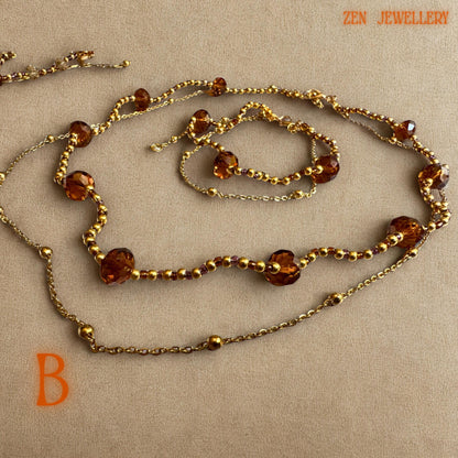 Elegant bohemian crystal necklace and bracelet set handcrafted with warm brown, champagne, and honey crystal beads paired with gold chain details. The faceted crystal shapes reflect light beautifully and create a sparkling glamorous appearance. The jewellery is lightweight and feminine with a handcrafted luxury feel suitable for festive styling, evening wear, or wedding guest fashion.