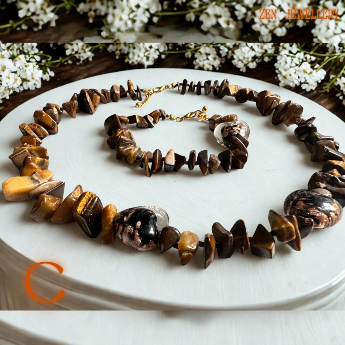 Handmade tiger eye necklace and bracelet set with glossy polished beads, warm honey tones, and gold metallic accents, creating a luxurious handmade accessory. The natural gemstone shine and delicate chain details give the jewellery timeless feminine elegance.