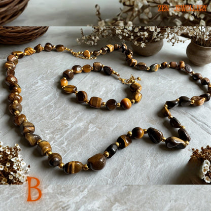 Matching tiger eye jewellery set with smooth honey brown gemstone beads arranged in an elegant layered style. The gold clasp and spacer details add refined contrast while the warm crystal tones create a calming and luxurious appearance.