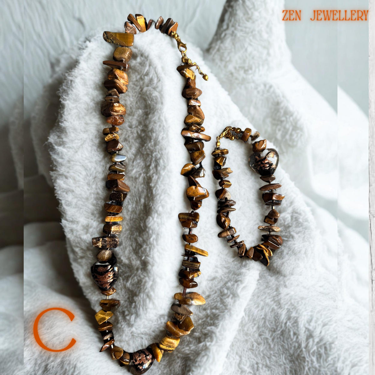 Lightweight tiger eye jewellery set featuring smooth brown gemstone beads and elegant gold chain links. The handmade necklace and bracelet create a stylish earthy fashion look perfect for casual outfits, evening wear, or layered jewellery styling.