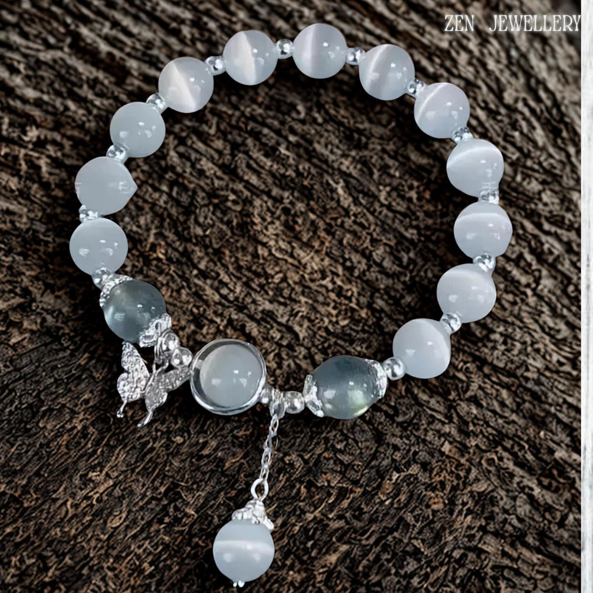 Artistic close-up displaying the butterfly charm suspended beside the central gemstone setting, showcasing intricate metal detailing and graceful silhouette while complementing the surrounding white gemstone beads, creating a romantic and feminine jewellery design suitable for bridal styling, anniversary celebrations and meaningful gifting occasions.