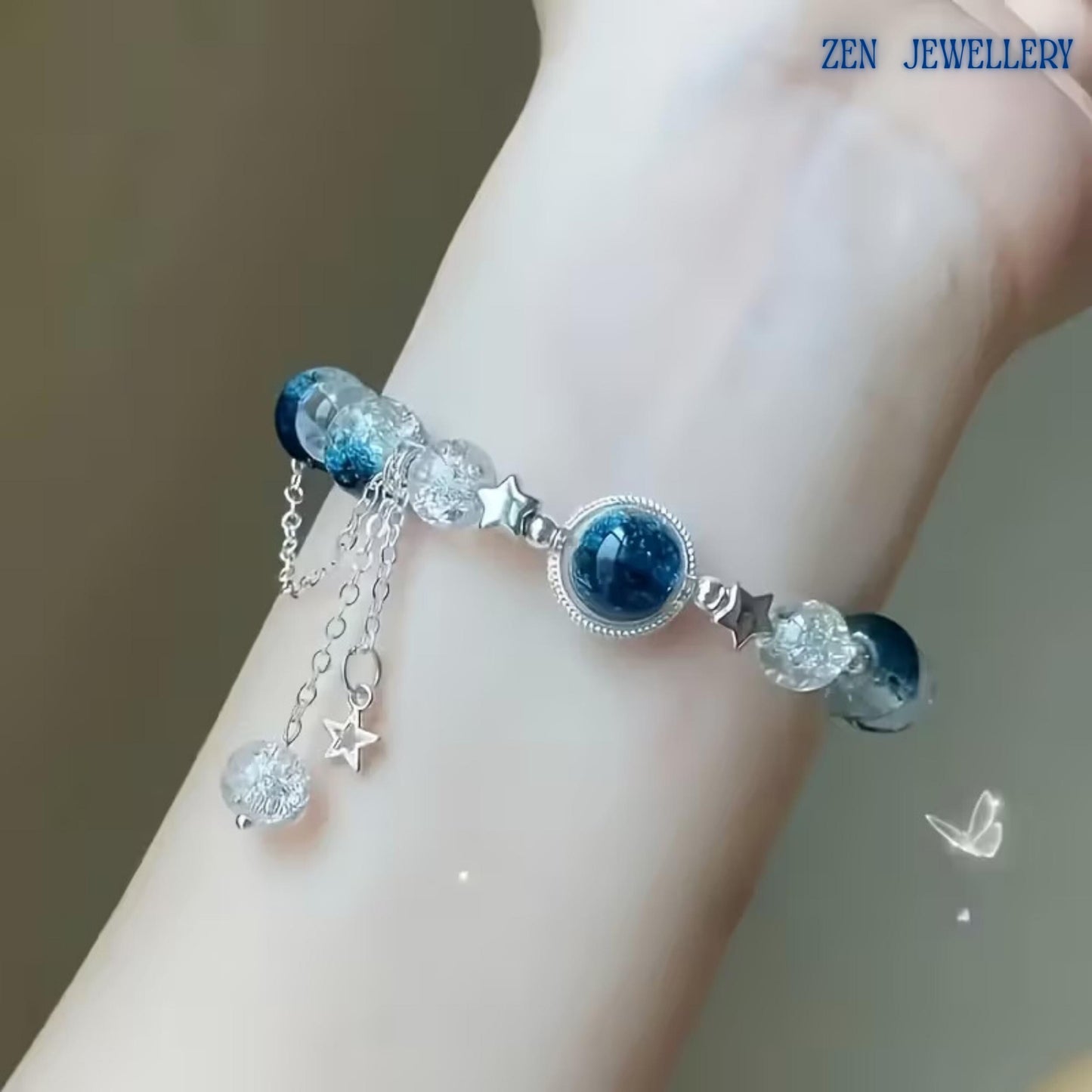 Macro image showcasing the crackle crystal beads in detail. Their textured transparent appearance reflects light from multiple angles, creating a sparkling effect similar to sunlight dancing on ocean waves. The contrast between the crystal-clear beads and dark blue gemstones enhances the luxurious and contemporary look of the bracelet.