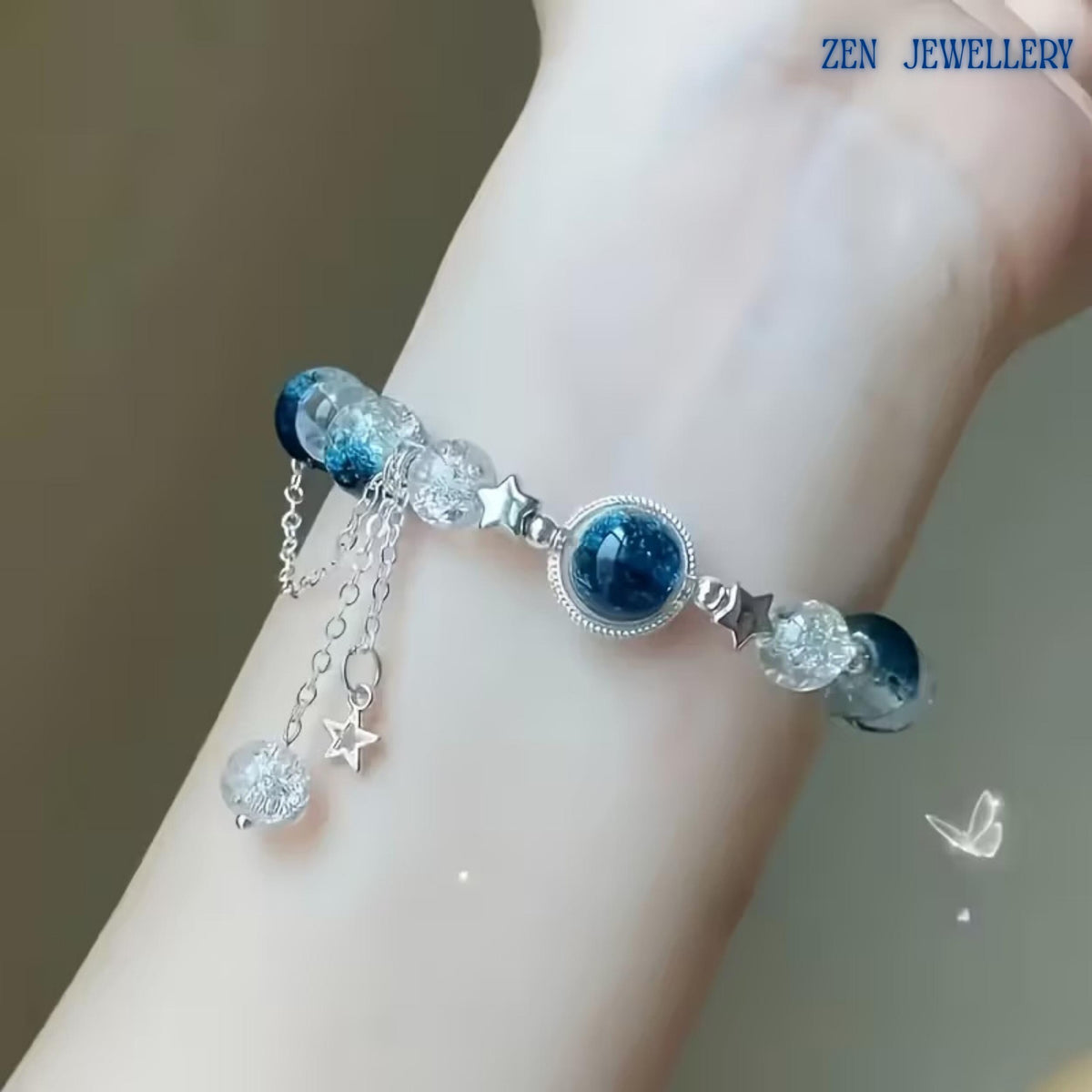 Macro image showcasing the crackle crystal beads in detail. Their textured transparent appearance reflects light from multiple angles, creating a sparkling effect similar to sunlight dancing on ocean waves. The contrast between the crystal-clear beads and dark blue gemstones enhances the luxurious and contemporary look of the bracelet.