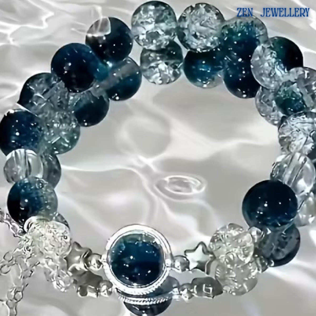 Detailed close-up of the silver star charm accents positioned near the centre gemstone. The stars symbolise hope, guidance, and inspiration while complementing the ocean-inspired colour palette. The polished silver finish reflects light beautifully and adds a celestial element to the bracelet’s sophisticated handcrafted design.