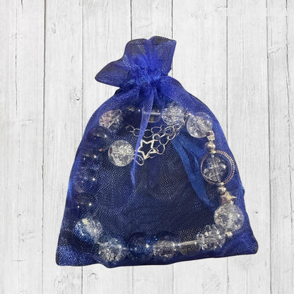 Unique blue glass bracelet with silver star detail, perfect gift for boho jewellery lovers in a gift bag