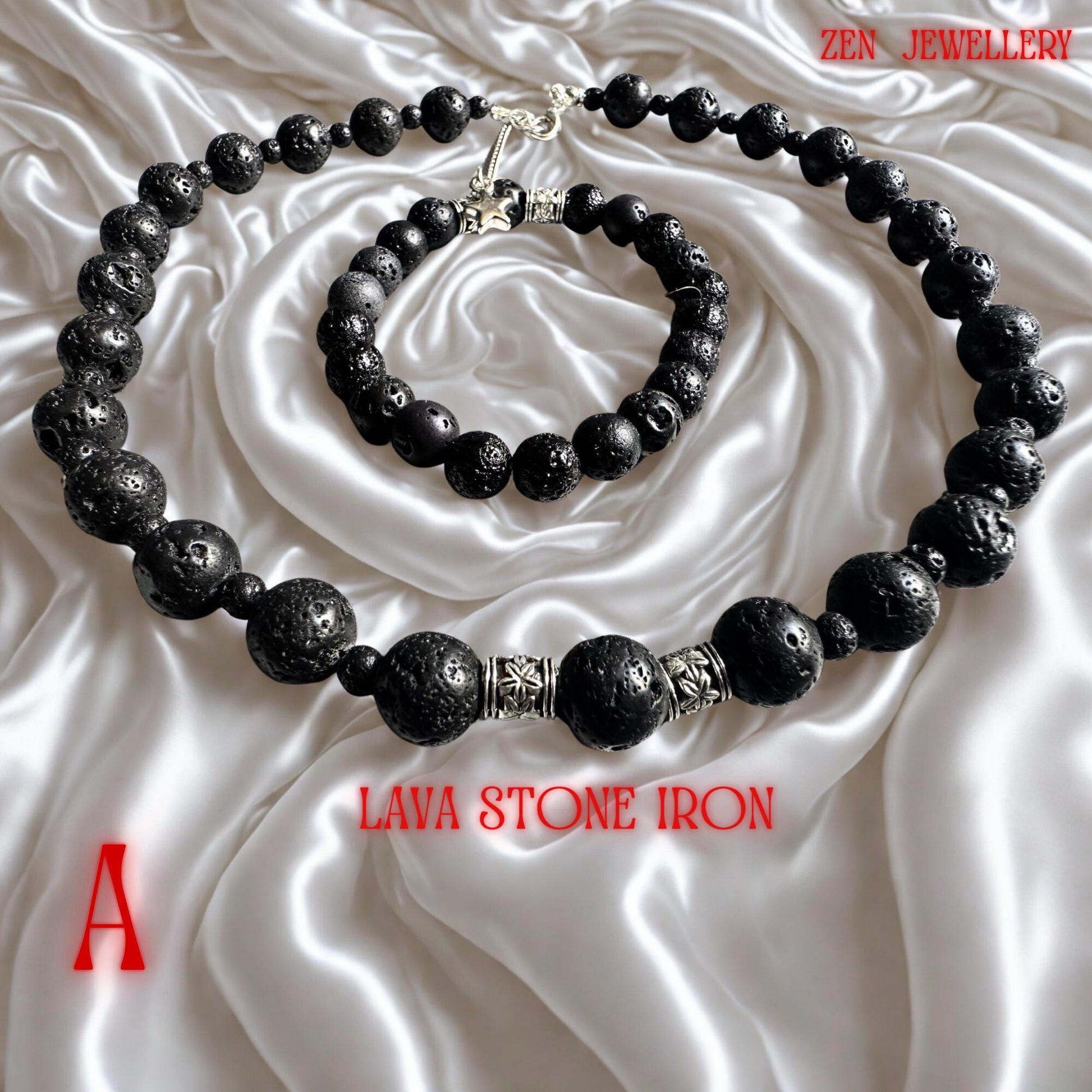 Artistic product image featuring a lava stone necklace and matching bracelet arranged together to highlight the rich volcanic texture and handcrafted construction. The black beads have an earthy matte surface with natural porous details created by volcanic stone formation. Elegant silver spacers provide a refined contrast and elevate the minimalist style of the jewellery set. The necklace closure includes a silver clasp and adjustable chain for c