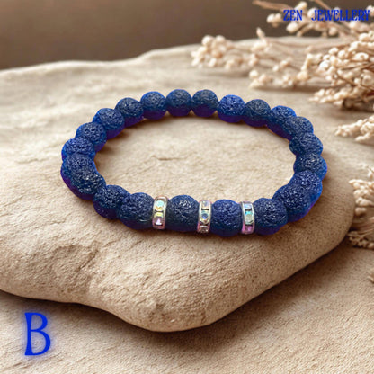 The navy blue lava stone beads in this handmade jewellery set create a calming and grounding appearance with rich matte texture and organic volcanic detail. Sparkling rhinestone spacers add subtle shine and contrast against the deep blue tones.