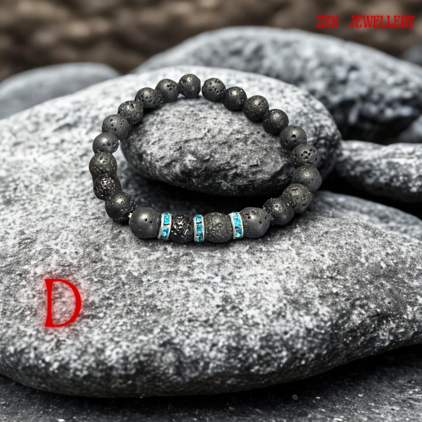 Handmade volcanic bead bracelet photographed in soft natural lighting to highlight the textured lava stones and reflective turquoise rhinestone spacer details. The bracelet has a calming minimalist appearance inspired by spiritual jewellery and grounding volcanic energy.