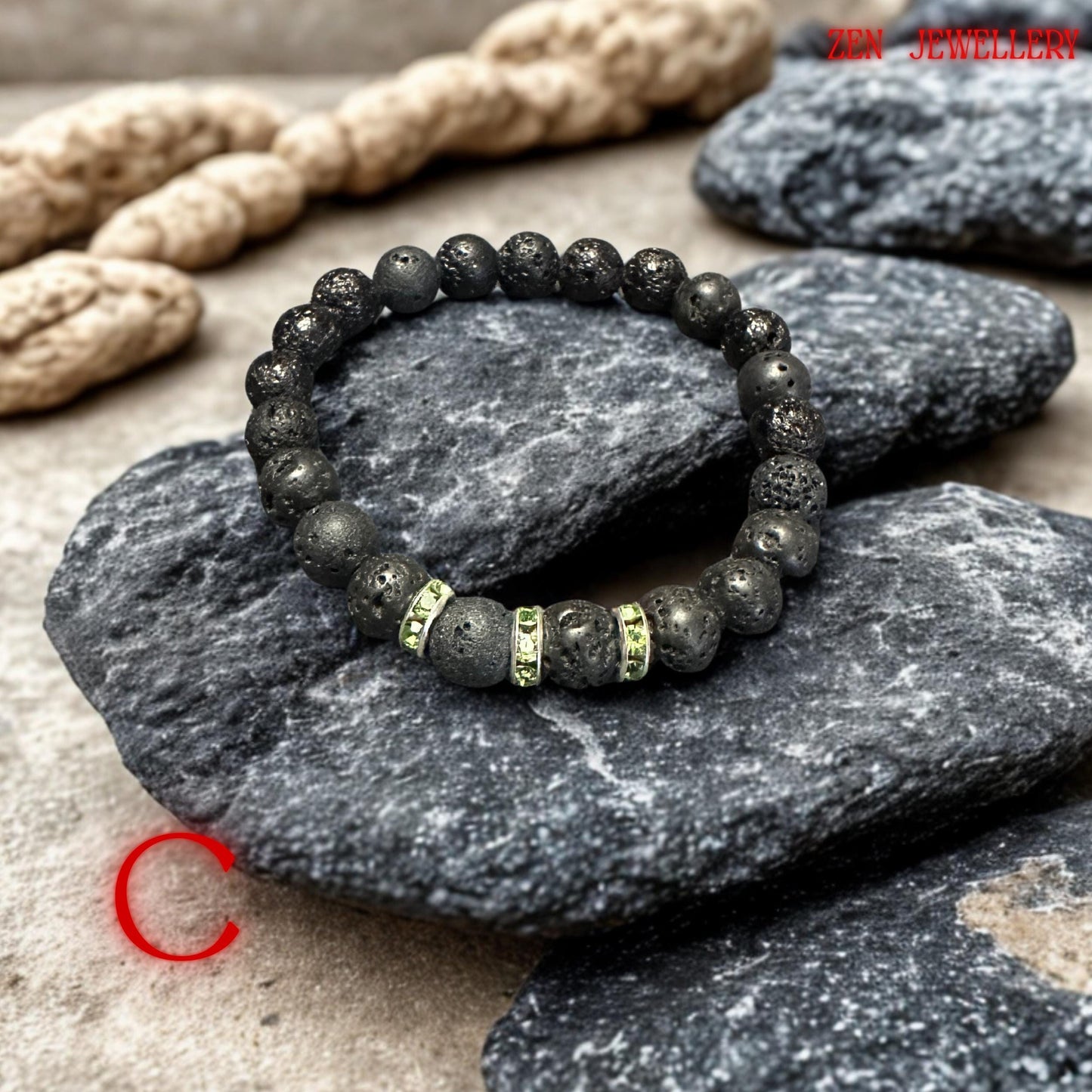 Elastic lava stone bracelet with sparkling green rhinestone spacers, perfect for layering or gifting.