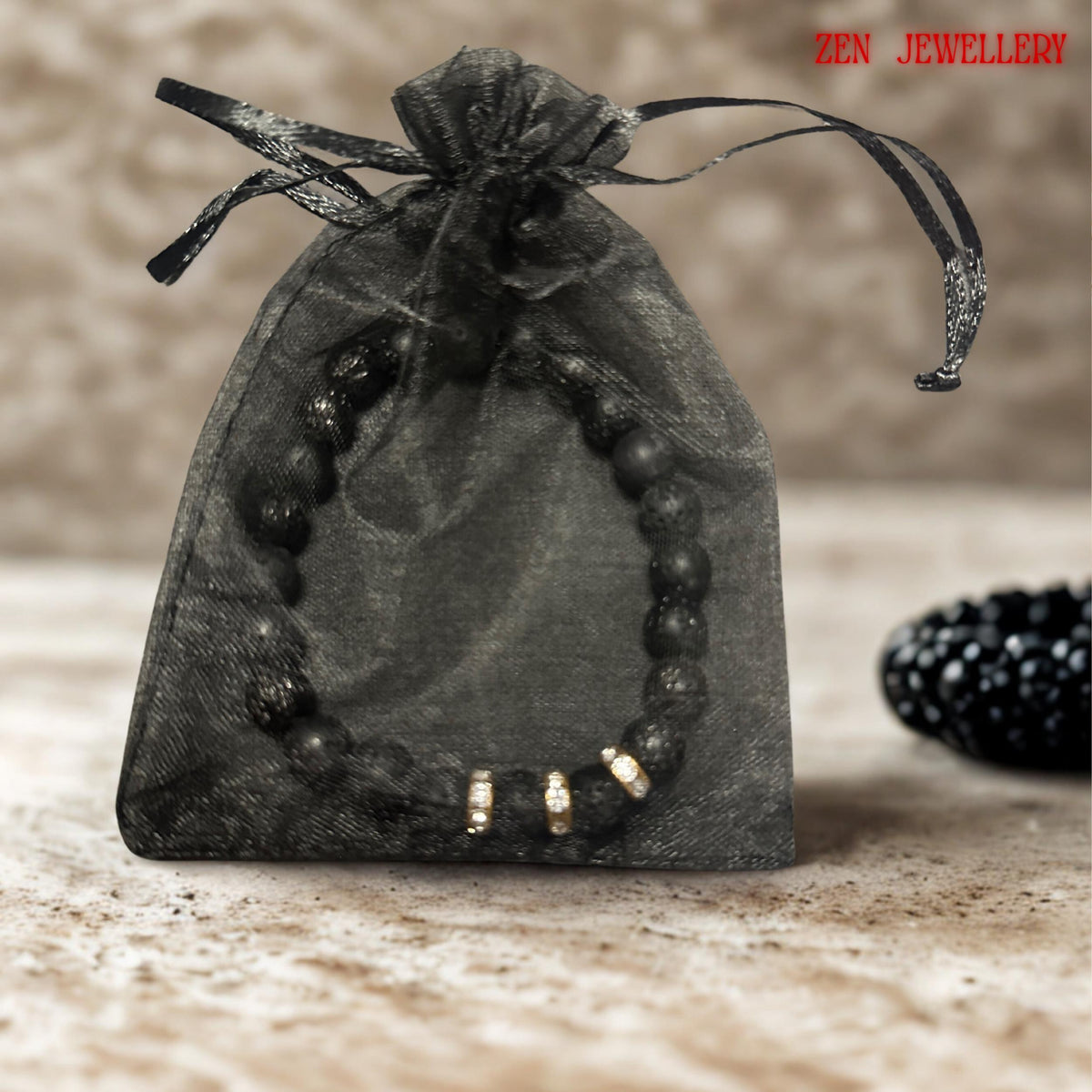 Handmade elastic bracelet with black lava stones and crystal rhinestone accents, elegant and durable. in a gift bag