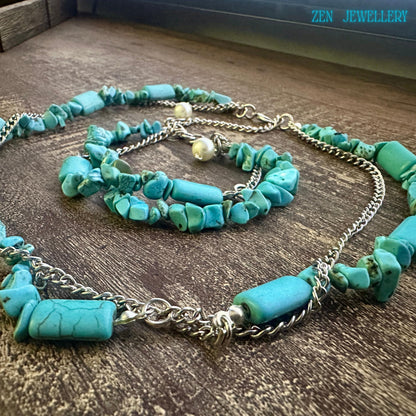 Close up of rectangular turquoise beads showing smooth polished surfaces with natural vein patterns and colour variations.
Bracelet clasp detail showing secure sterling silver fastening and adjustable chain for comfort across wrist sizes.