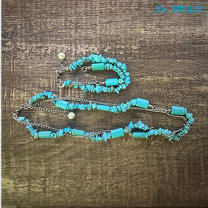 Close up Turquoise howlite jewellery set with silver chain, displayed on wooden surface, mindful healing gemstone accessories