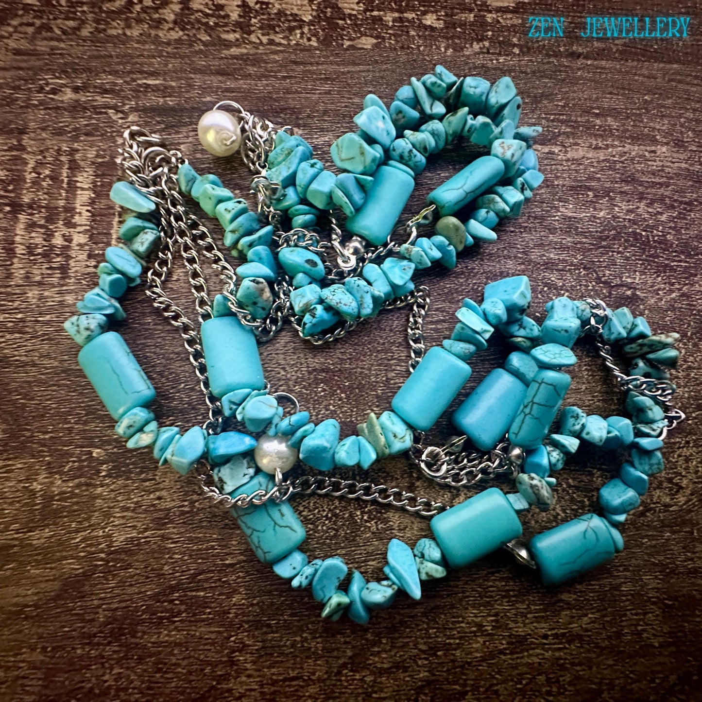 The turquoise chips shown in detail to highlight the organic shapes and artisanal hand-strung craftsmanship.