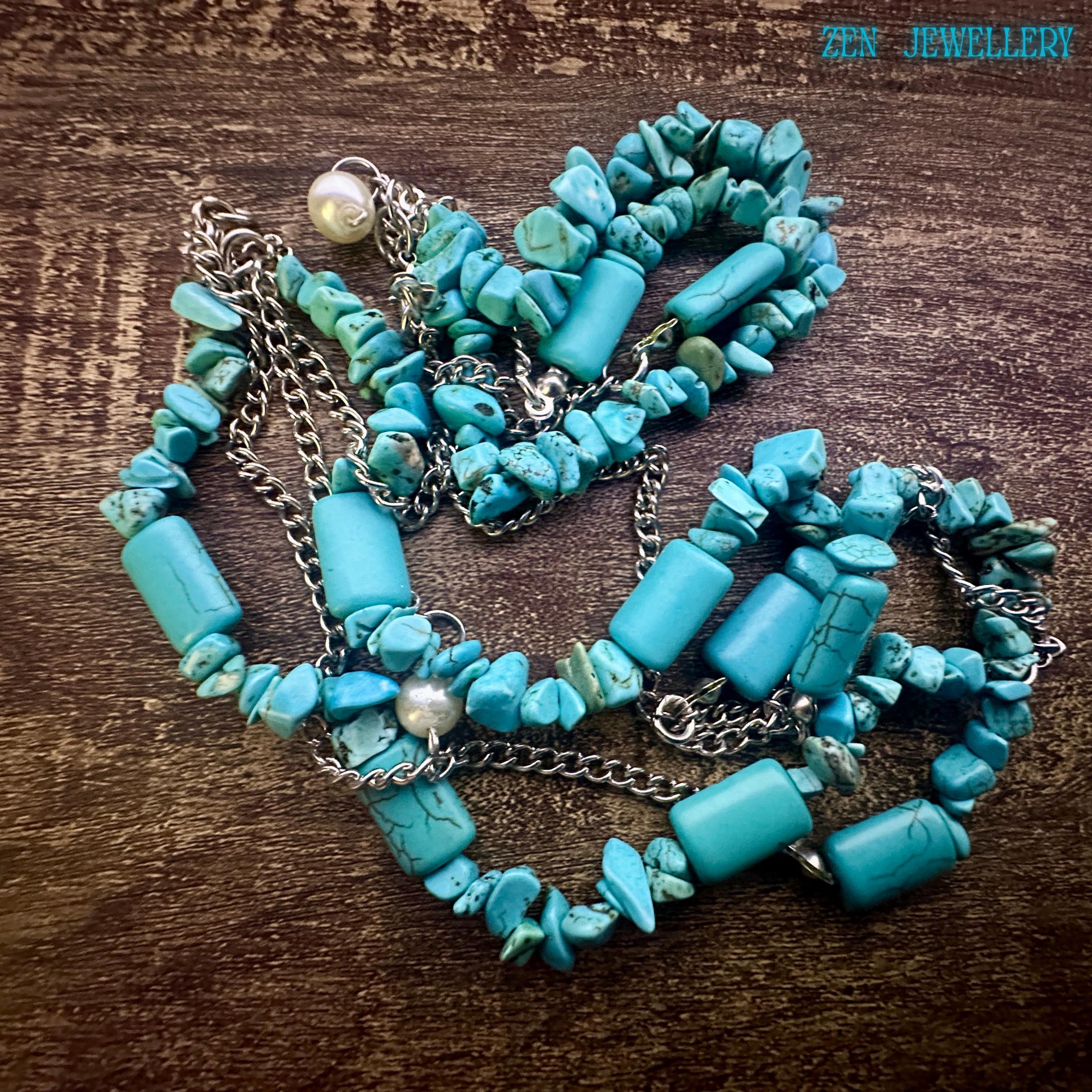 The turquoise chips shown in detail to highlight the organic shapes and artisanal hand-strung craftsmanship.