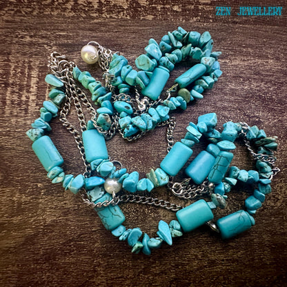 The turquoise chips shown in detail to highlight the organic shapes and artisanal hand-strung craftsmanship.