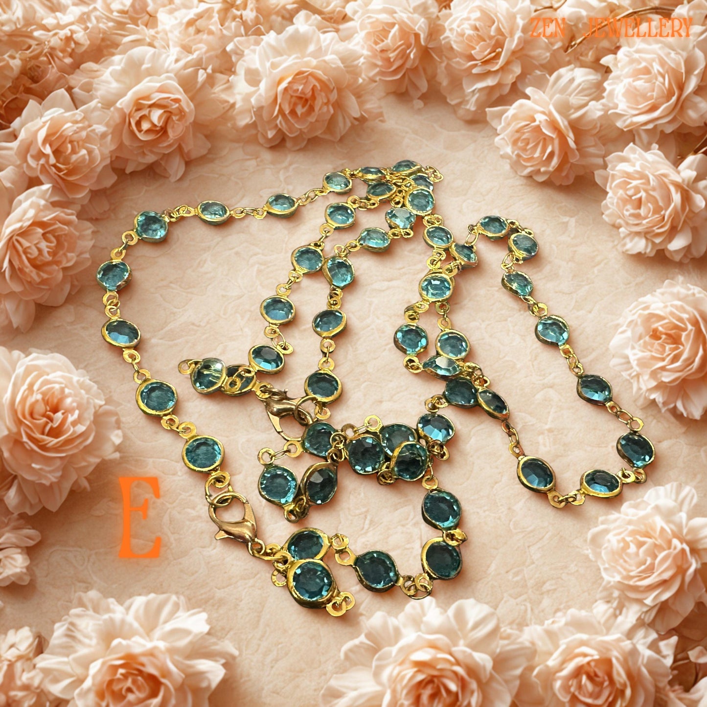 Emerald green crystal jewellery set featuring faceted stones linked with vintage inspired gold chain and subtle rhinestone details. The sparkling green gemstones reflect light beautifully and create botanical elegance inspired by natural luxury and romantic garden styling. Coordinated necklace and bracelet provide versatile styling options for elegant fashion, festive celebrations, or meaningful handmade gifting.