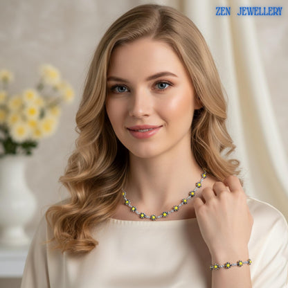 Handmade Crystal Silver flower necklace and bracelet displayed in an artistic arrangement highlighting the intricate floral crystal design. The bright yellow crystal flowers resemble blooming daisies and sunflowers, symbolising happiness and positivity. Silver-tone chain links provide contrast and elegance while allowing flexibility and comfort. This unique jewellery set complements spring wardrobes, outdoor celebrations, and handmade jewellery c