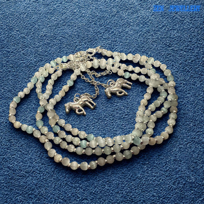 Detailed necklace presentation highlighting the continuous strand of carefully selected white crystal beads combined with sterling silver accents. The horse charm attached to the extension chain provides a unique finishing touch for horse lovers and riders. Necklace measures 49 cm with additional adjustment for personalised styling.