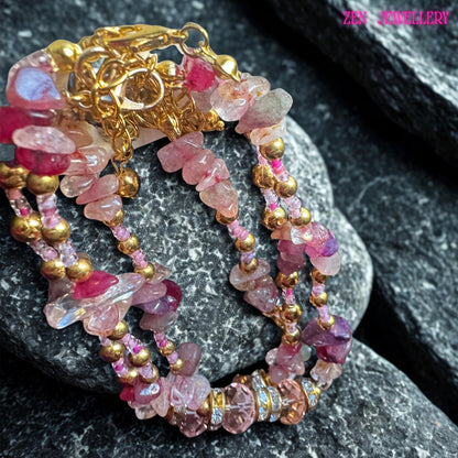 Handmade multi-strand wrap bracelet showcasing beautiful pink gemstones in varying shades of blush, dusty rose, and deep raspberry. Each strand is carefully designed with sparkling crystal beads and gold-tone spacers that enhance the luxurious bohemian style. The bracelet wraps gracefully around the wrist, offering a layered, elegant look ideal for fashion lovers who enjoy feminine, romantic accessories with a touch of natural gemstone beauty and