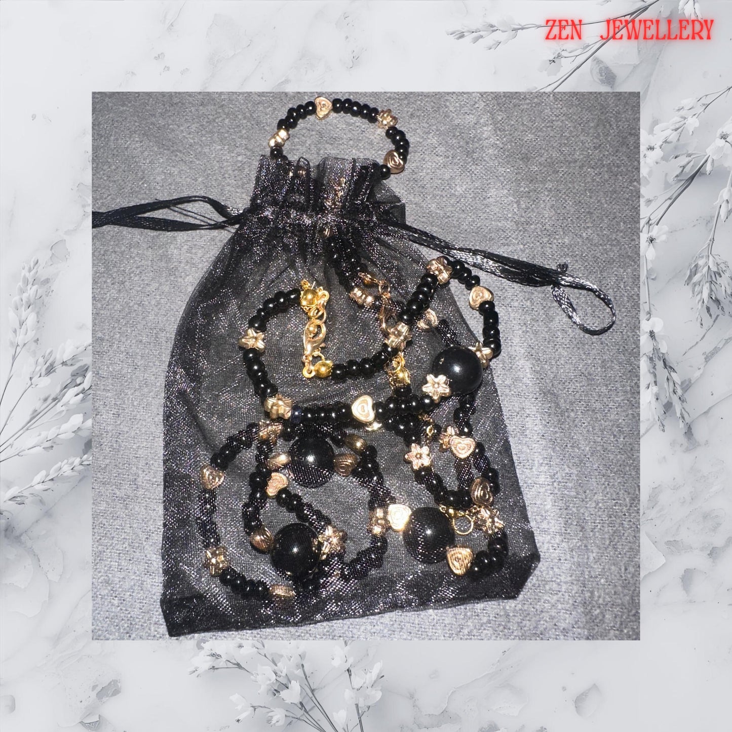 Lightweight artisan handmade necklace and bracelet set with black and gold beads for layering or solo wear.