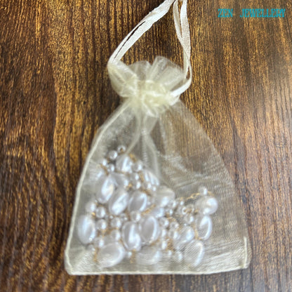 Handmade minimalist necklace with white pearls on gold chain, perfect for layering or solo statement.