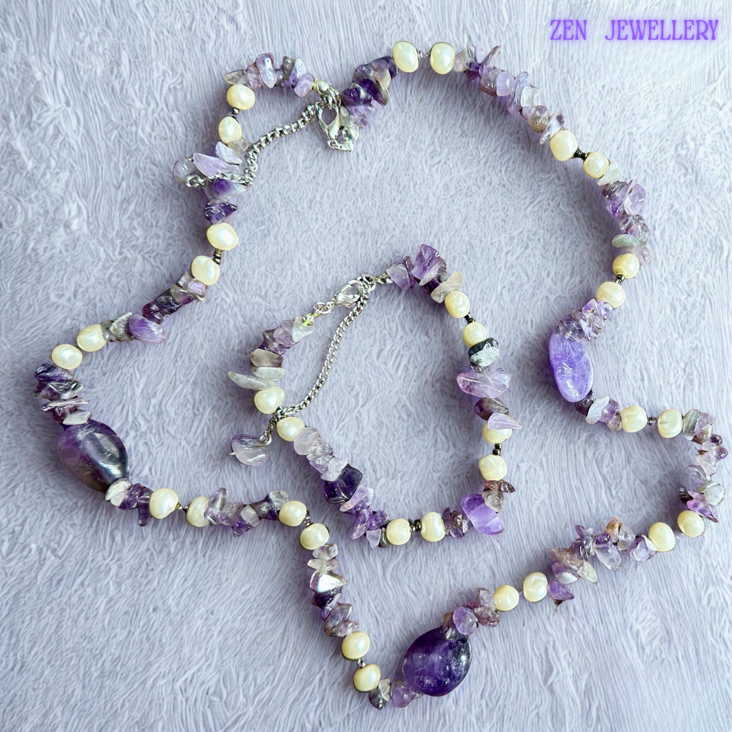• Delicate silver clasps and extension chains provide adjustable comfort and elegant finishing details to this handmade amethyst jewellery set. The natural gemstone textures and pearl-style accents create soft feminine balance inspired by artisan boho jewellery collections.