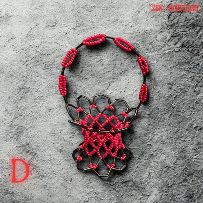 The image captures the mini decorative basket standing upright, showing its detailed wire structure beneath the beadwork.