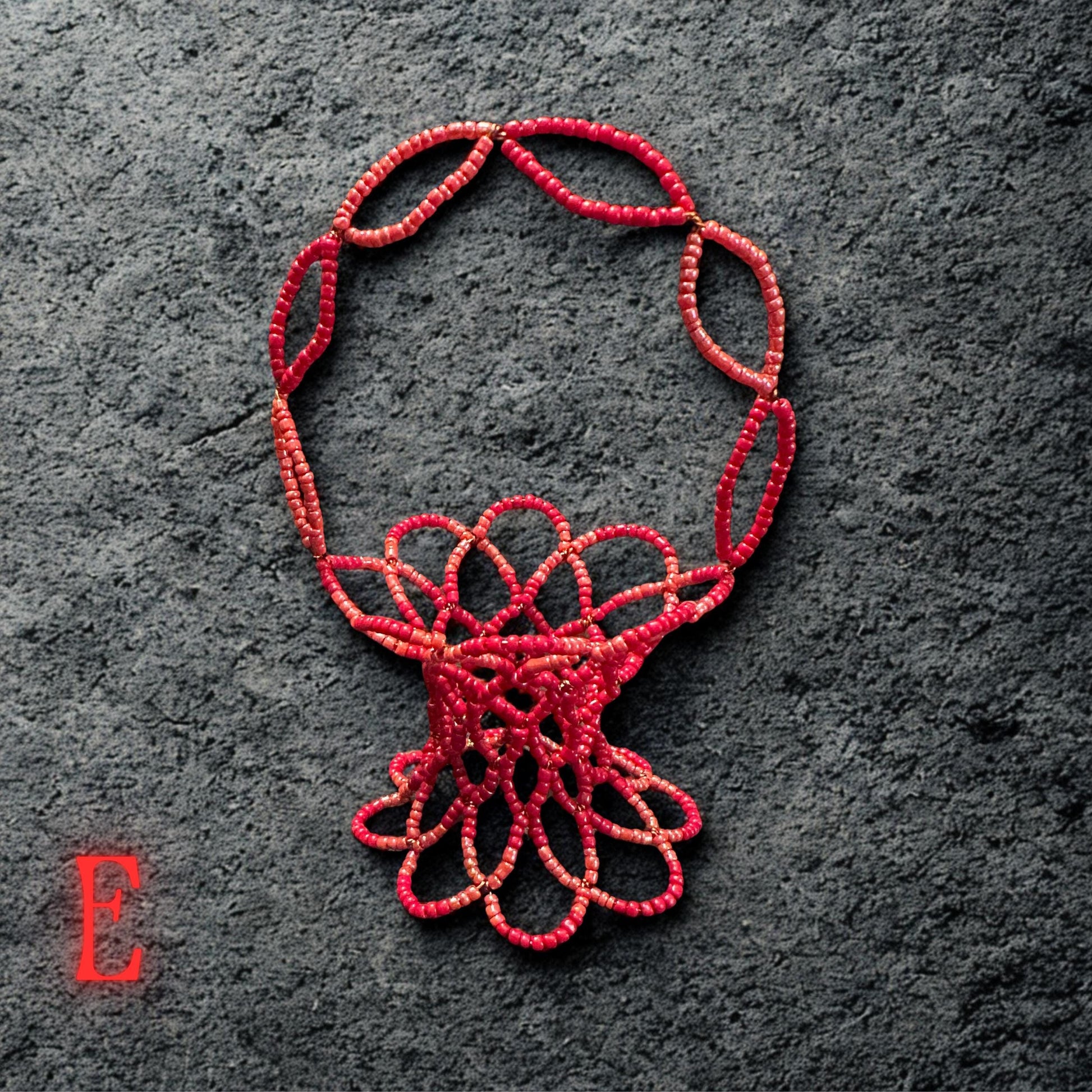 A top-angle shot shows the circular pattern of the red beads arranged neatly around the basket’s rim.