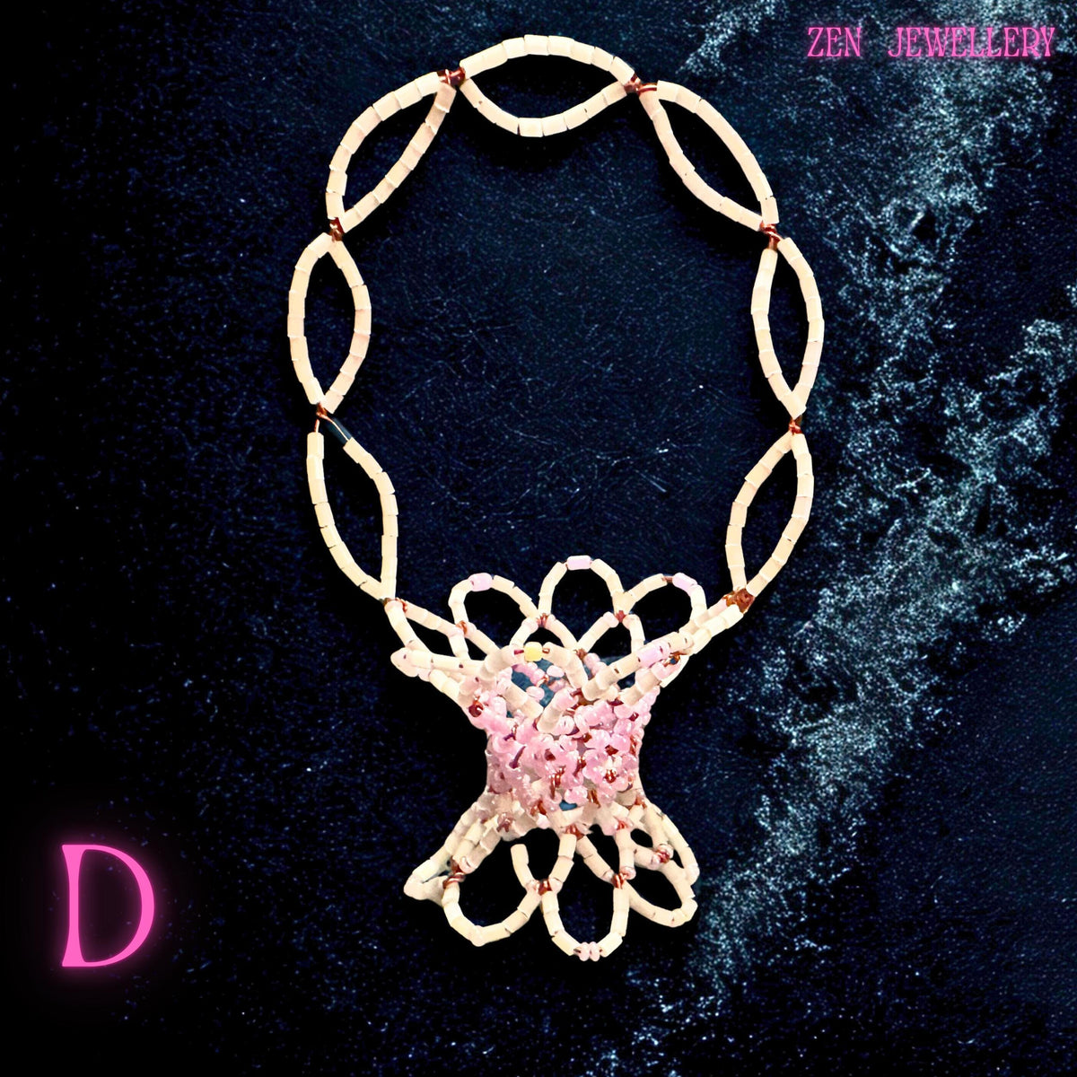 Handwoven beadwork basket featuring pastel pink beads and delicate matched colour accents.