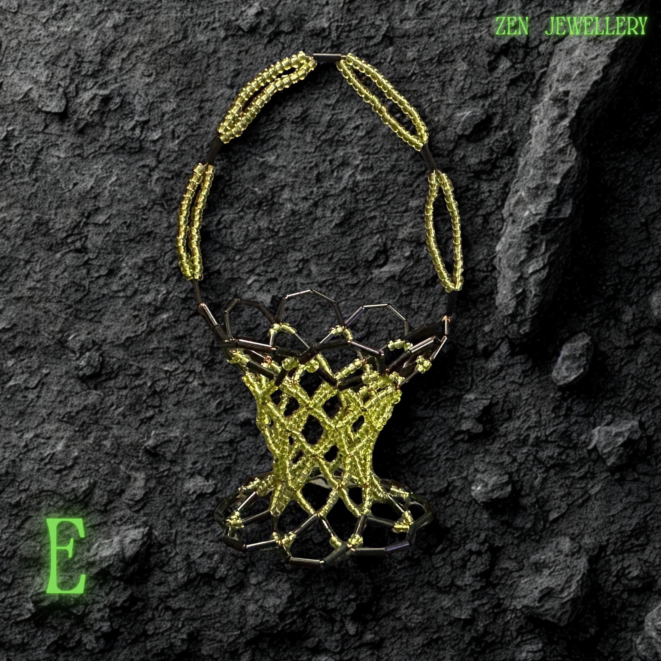 Side angle of a handmade green bead basket showing its curved structure and detailed craftsmanship