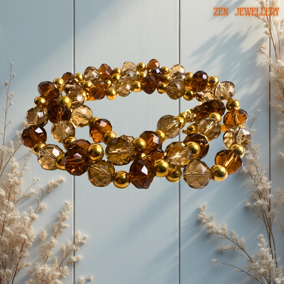 • Handmade evening jewellery set with warm golden crystal reflections and faceted brown beads styled beautifully on dark natural stone. The crystal surfaces catch the light from different angles creating soft sparkle and glamorous texture throughout the necklace and bracelet design.