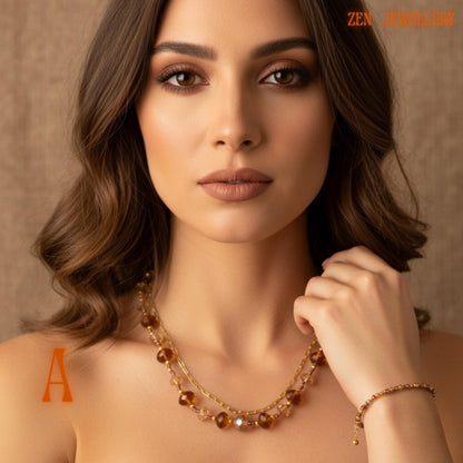 Side angle view of handcrafted Austrian crystal jewellery set showing sparkling champagne crystal beads, bronze tones, and elegant gold clasp details. The faceted beads create reflective shine and soft texture while the gold chain sections add delicate movement and lightweight comfort. The matching bracelet completes the elegant layered jewellery design.
