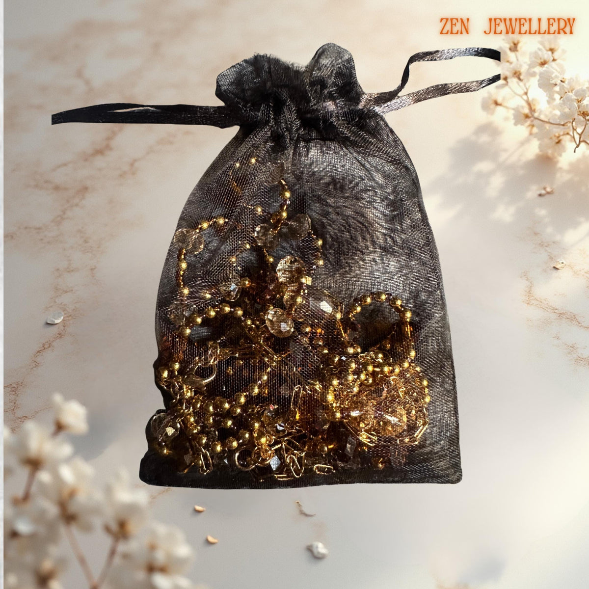 Handcrafted jewellery set combining brown and champagne Austrian crystals with polished gold beads for radiant sparkle in a gift bag from Zen Jewellery
