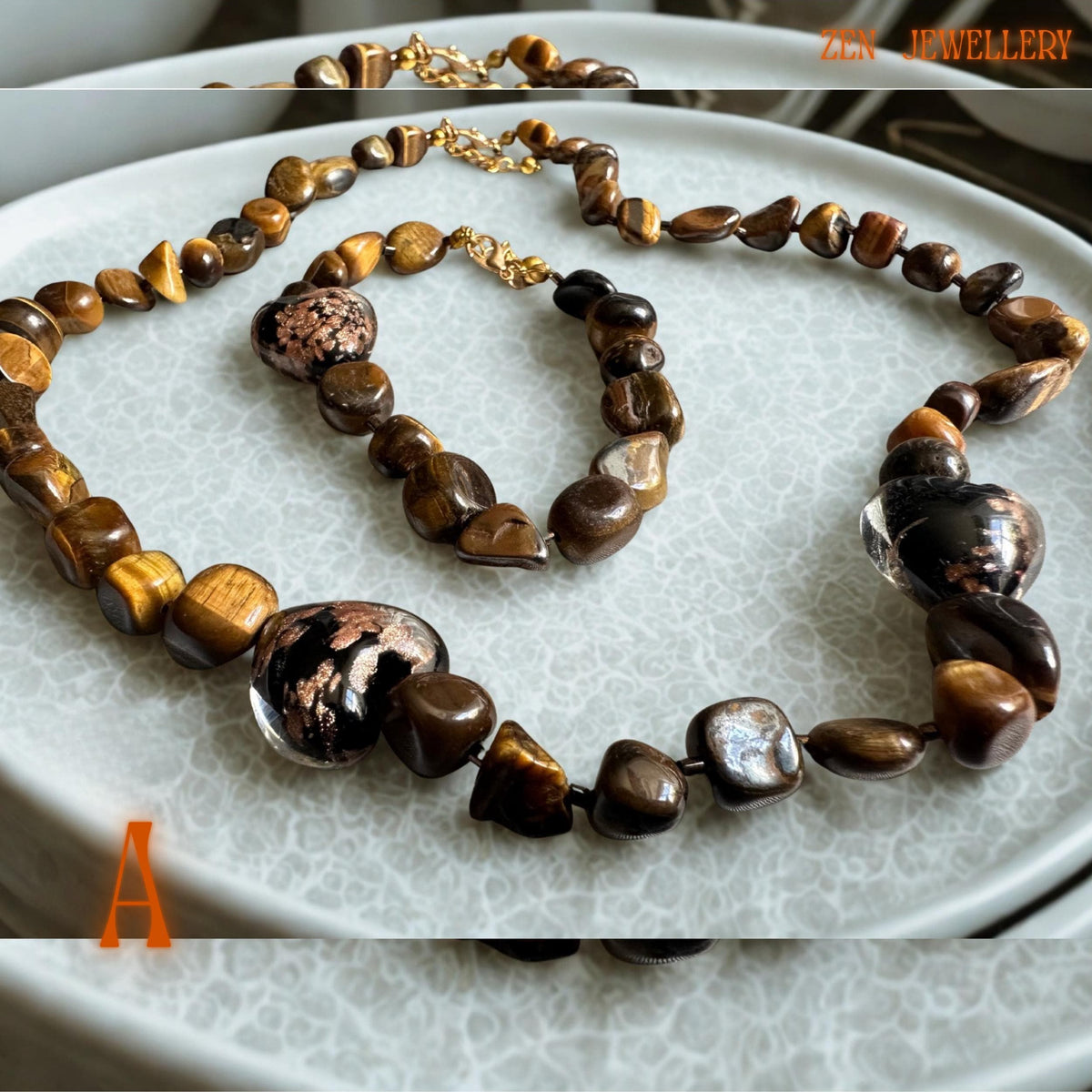 Handmade tiger eye jewellery set with warm caramel and golden brown gemstone beads arranged in a matching necklace and bracelet design. The polished stones create soft reflective shine, while the gold clasps and spacer beads add elegant detail and a luxurious handcrafted finish perfect for everyday styling or gifting. A glass heart in the middle of the necklace and bracelet.