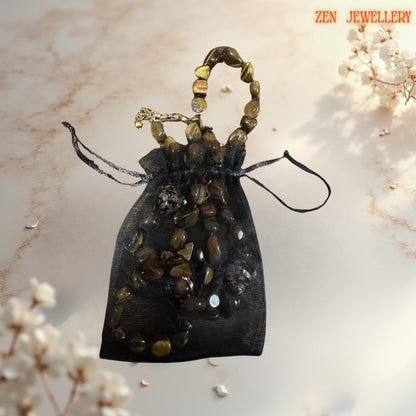 Elegant gemstone jewellery featuring tiger eye stones with silky lustre, paired with romantic heart-shaped glass in a pouch gift from the zen jewellery brand