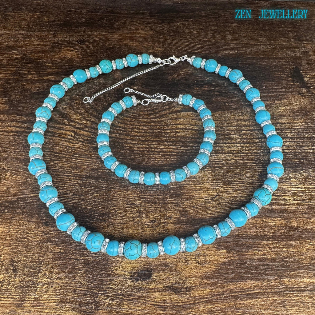 Turquoise beaded necklace close-up showing clasp and extension chain details.