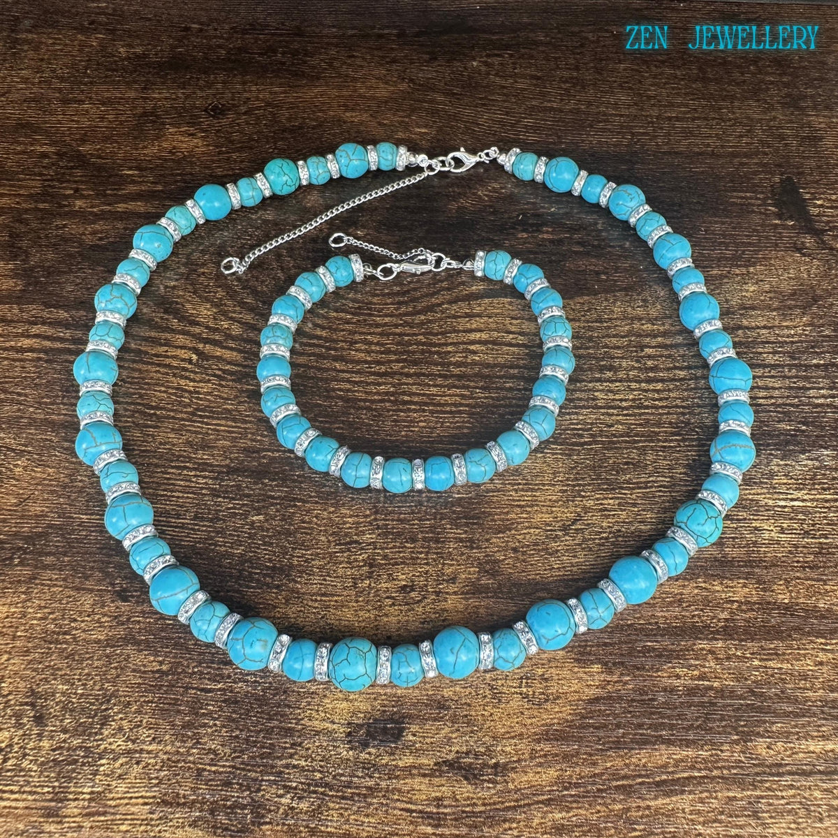 Turquoise beaded necklace close-up showing clasp and extension chain details.
