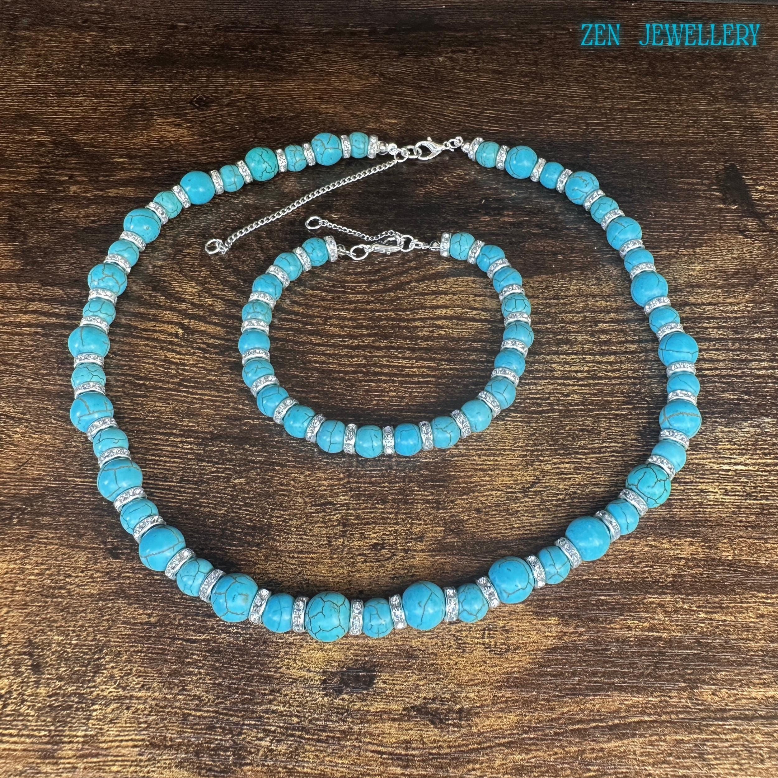 Turquoise beaded necklace close-up showing clasp and extension chain details.
